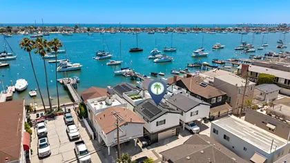 Front-row views of Newport Harbor from this coveted bayfront location