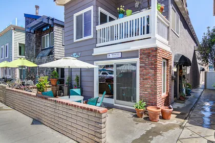 This listing pertains to the downstairs unit of this property, with its own private patio for daytime sunning or evening cookouts.