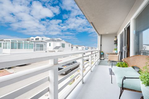The front balcony deck includes a grill and pull-down shade, perfect for evening cook outs.