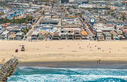 Vibrant coastal neighborhood set along pristine shoreline and scenic beach paths