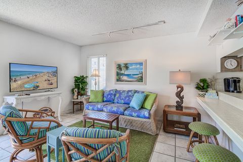 The main living area includes cable TV and plenty of seating to unwind after a day at the beach.