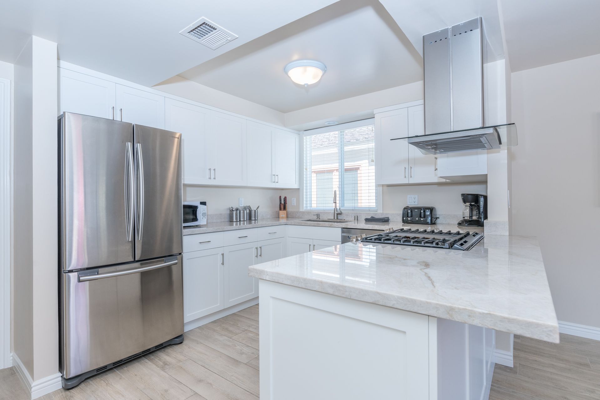 Updated kitchen is fully-stocked with dishes, cooking, baking and meal prep gear. All standard large and small appliances included. See listing description for more supply details.