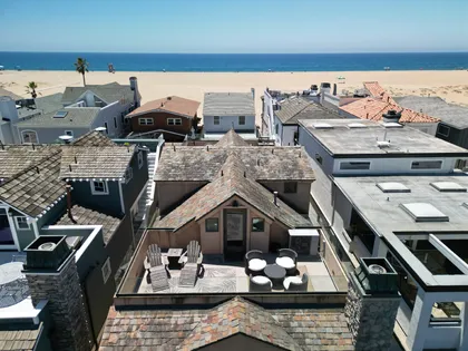 Aerial view of the bay view rooftop deck, with dining and seating areas.