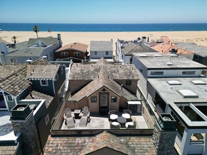 Aerial view of the bay view rooftop deck, with dining and seating areas.