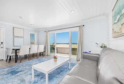 This split-level downstairs unit is a beautifully appointed, stylish property in a terrific location at 34th Street beach!