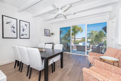 Sliding doors open from the second level's living area out to the main patio, for that iconic SoCal indoor/outdoor lifestyle.