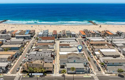 Sweeping aerial of beachfront living with endless ocean views and golden sands