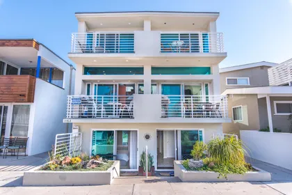 43rd Street view of the entire building that is comprised of 2 separate, side by side condos. This listing information only pertains to the right, 3-level condo. The left side condo can also be rented when available. See separate listing.