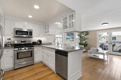 The kitchen comes stocked with dishes, utensils, cookware, bakeware, and major and small appliances.