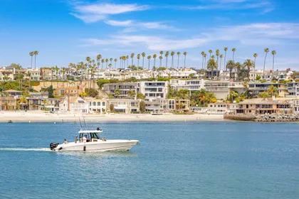 This beloved island neighborhood is surrounded by the calm waters of Newport Harbor