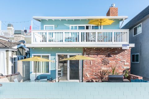 The front exterior of this lower-level unit. Guests have exclusive use of the downstairs patio, which includes a dining table for four, market umbrella, and gas BBQ grill.