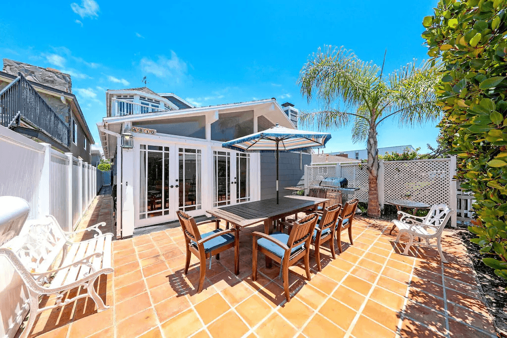 This private and cheery front patio includes seating for 6-8 along with additional seats for soaking up the sun.