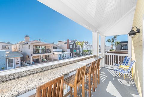 The front balcony includes propane gas BBQ, granite countertop with barstool seating for 4, side seating for 2, and an ocean view.
