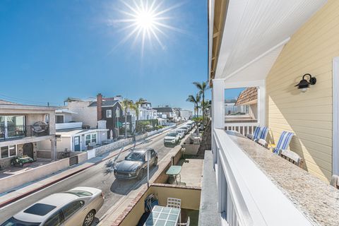 View of the street leading to the beach. This home includes two tandem parking spots in the back garage, but there is also free street parking in the surrounding neighborhood.