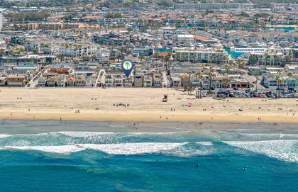 Sweeping coastal perspective highlighting the vibrant Newport Beach shoreline and surrounding neighborhood