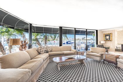 Like the whole of the house, the main living area features a mid century design with antiques and fine art throughout.