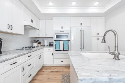 The kitchen comes stocked with dishes, utensils, cookware, bakeware, and small & large appliances.