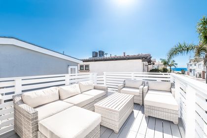 Oceanview deck with generous lounge seating for relaxing under the coastal sun