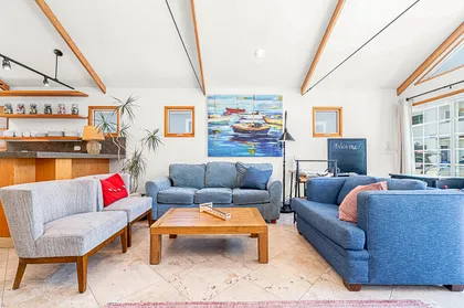 Bright, open living room with comfortable seating and coastal-inspired design