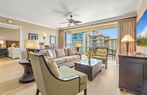 Bright, airy living space with floor-to-ceiling glass that opens to your private lanai and stunning Maui scenery.