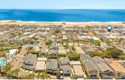 Drone perspective highlighting the home’s prime coastal setting, only two houses from the shore