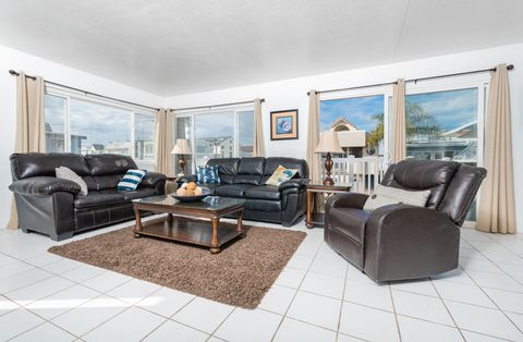 A hop, skip and a jump away from the sand, this sunny upstairs unit is the perfect location for your next family vacation.