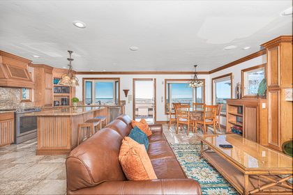 The open floor plan that blends kitchen, living, and dining areas is the perfect recipe for group hangouts.