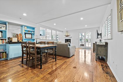 French doors open from the living area to the front patio, inviting in fresh ocean air and effortless indoor-outdoor living