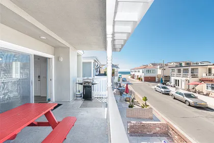 Ocean views and breezes can be enjoyed from the second level front balcony, with outdoor dining, extra seating and propane BBQ grill.