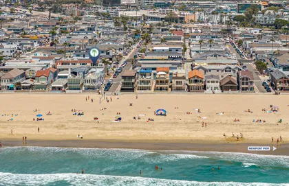 Bird’s-eye view of the Newport Beach shoreline with the home just steps from the sand