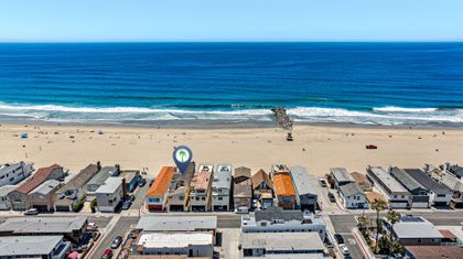 Positioned along the shoreline, this oceanfront retreat offers effortless access to the beach, boardwalk, and classic Newport charm