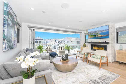 Sink into the plush sectional and unwind by the fireplace while catching your favorite show on the flat screen TV