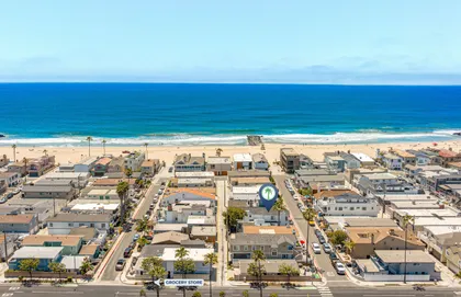 Aerial views of the peninsula and the sparkling Pacific just steps away from your downstairs Newport Beach retreat
