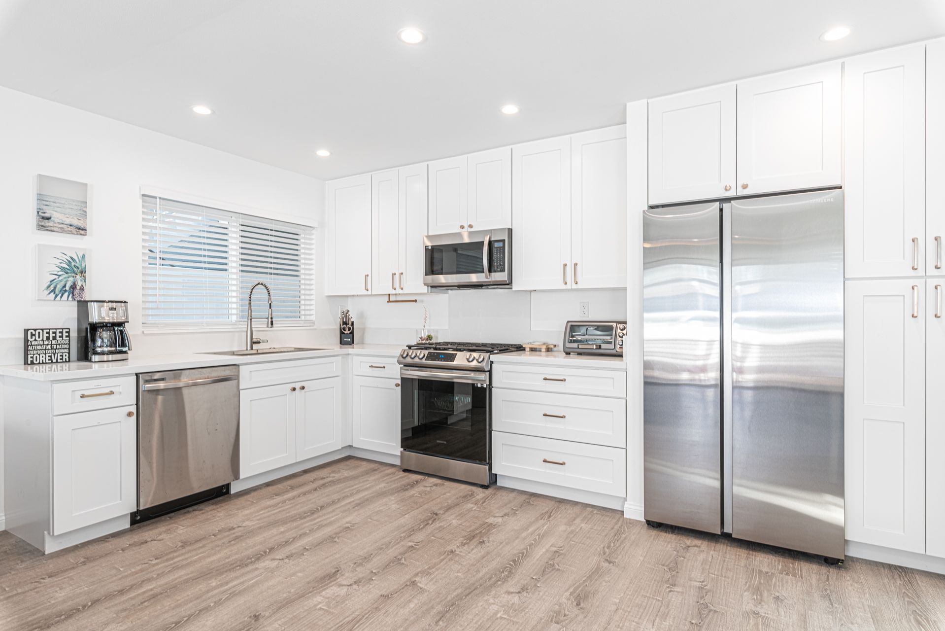 The kitchen comes stocked with all your meal prep needs: large & small appliances, dishes, utensils, cookware, and bakeware.