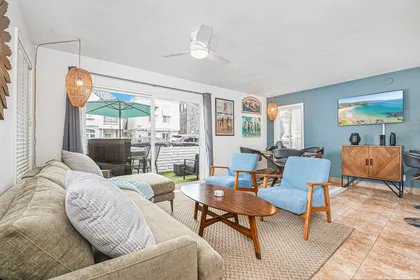 Bright and inviting living area with comfortable seating and seamless indoor-outdoor flow