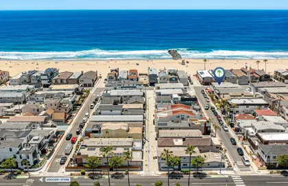 Aerial view of the home’s prime Peninsula location just one house from the sand and steps from the shoreline
