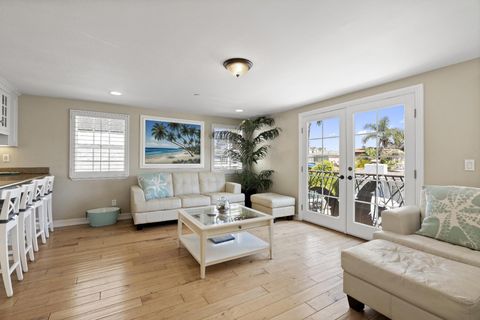 A taste of Aloha is splashed throughout this upper unit, with each room full of natural light, comfy-yet-stylish furnishings, and all the fixin's for a relaxing beach getaway.