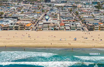 Sweeping aerial view of the beach and neighborhood just steps from the ocean