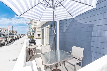 The beach is just 10 homes away from your front door (see it in the distance?), which means you'll catch fresh ocean breezes from the patio.