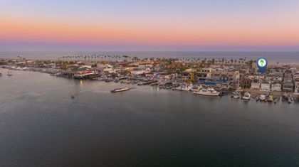 Aerial view of the property, perfectly flanked by the bay and beach.