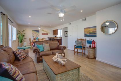 Main living spaces with ample and comfortable seating. Open floor plan between living, kitchen and dining areas.