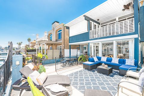 Experience the serenity of this bayfront location, including two spacious split-level patios overlooking one of Newport Harbor's quiet side channels.