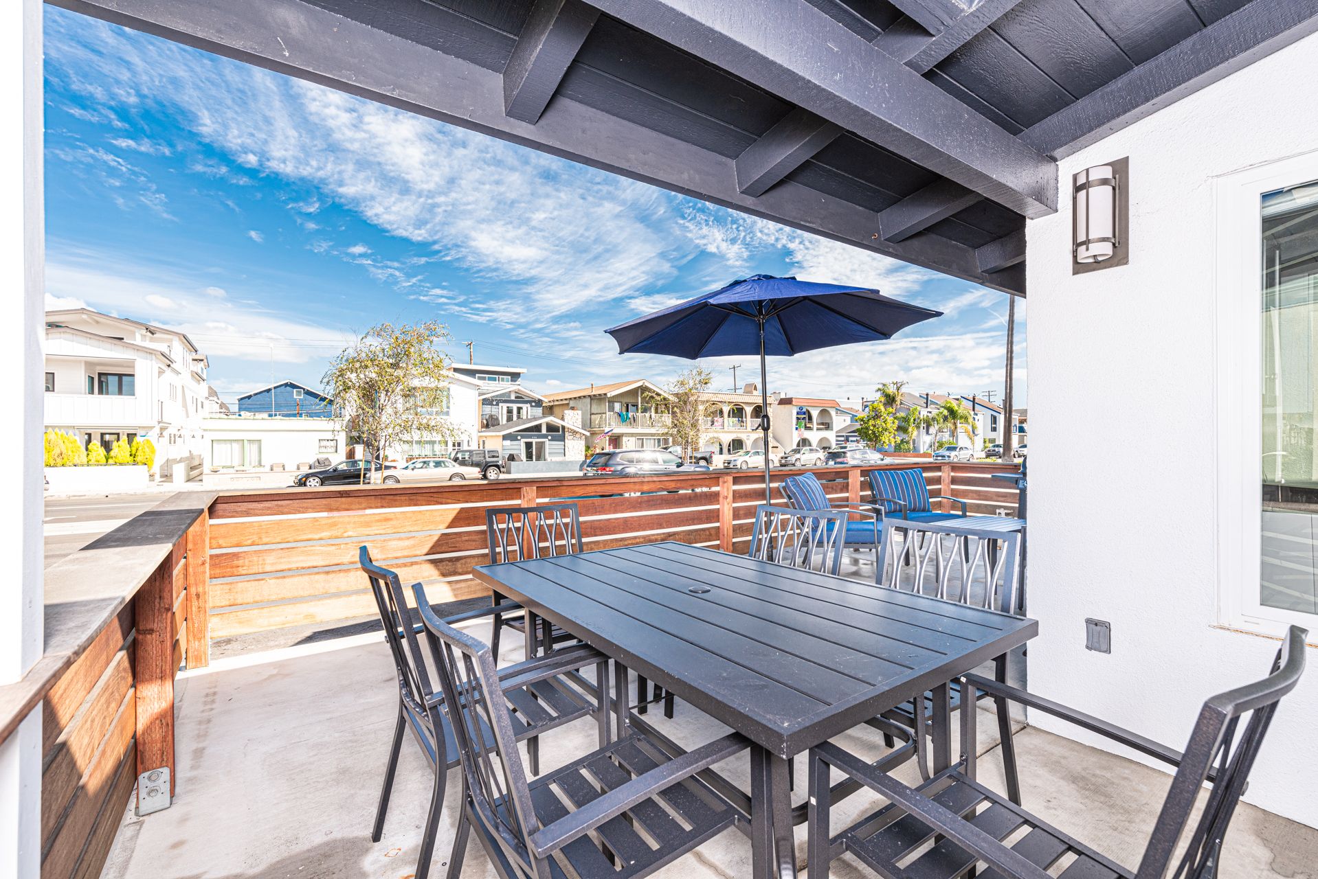 The large front patio includes a dining area with seating for 6.