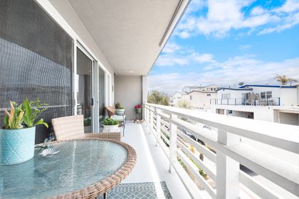 The front balcony deck includes a grill and pull-down shade, perfect for evening cook outs.