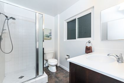 Upstairs bathroom located at the top of the stairs and includes a step-in shower.