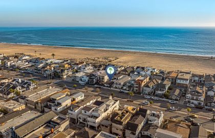 Aerial view showcasing the home’s prime location just steps from the sand