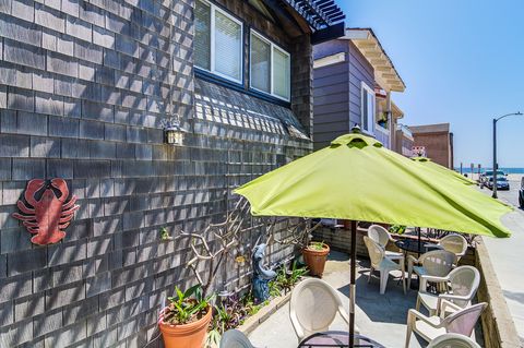 Enjoy full access to the front patio, featuring a dining table for four, a market umbrella, a propane grill, and beautiful ocean views