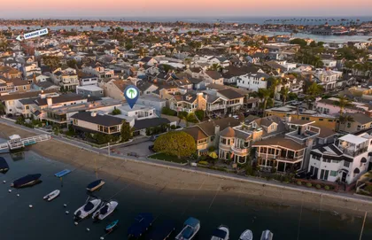 Golden hour over the bay, showcasing the charming waterfront homes and tranquil island setting