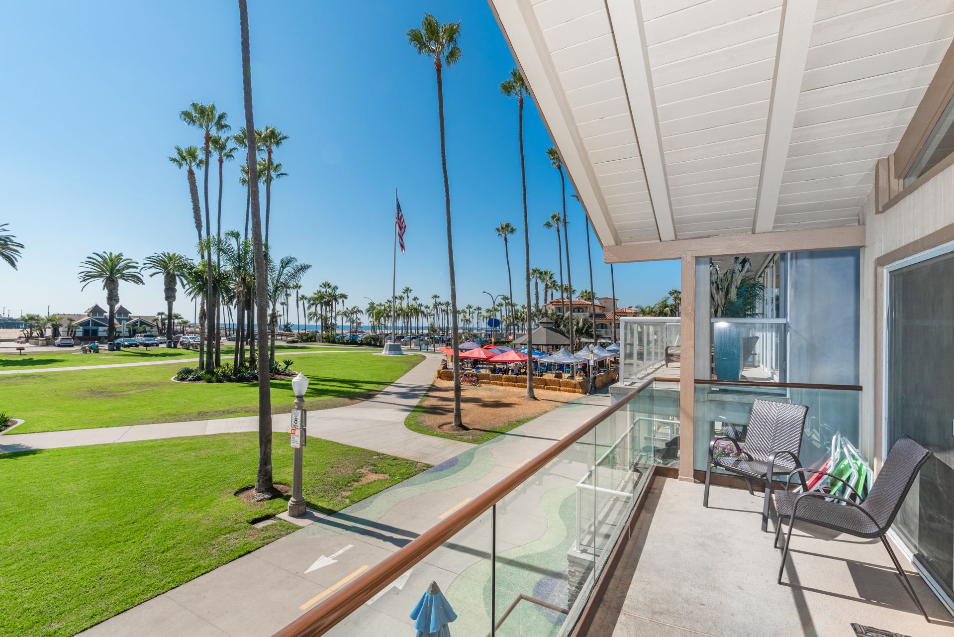 Expansive view from the upstairs patio: Balboa Pier area, local restaurants, and ocean beyond!