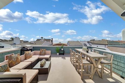 There's not one but two rooftop decks on the third level of this home. This is the Oceanview deck, with ample outdoor seating and a propane gas BBQ grill.